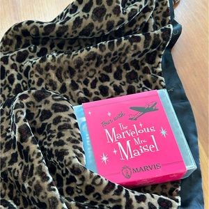 Leopard print scarf and travel toothpaste.